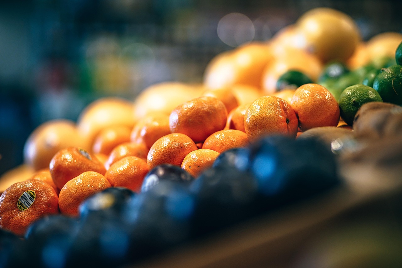 Oranges and limes are shown on a grocery display