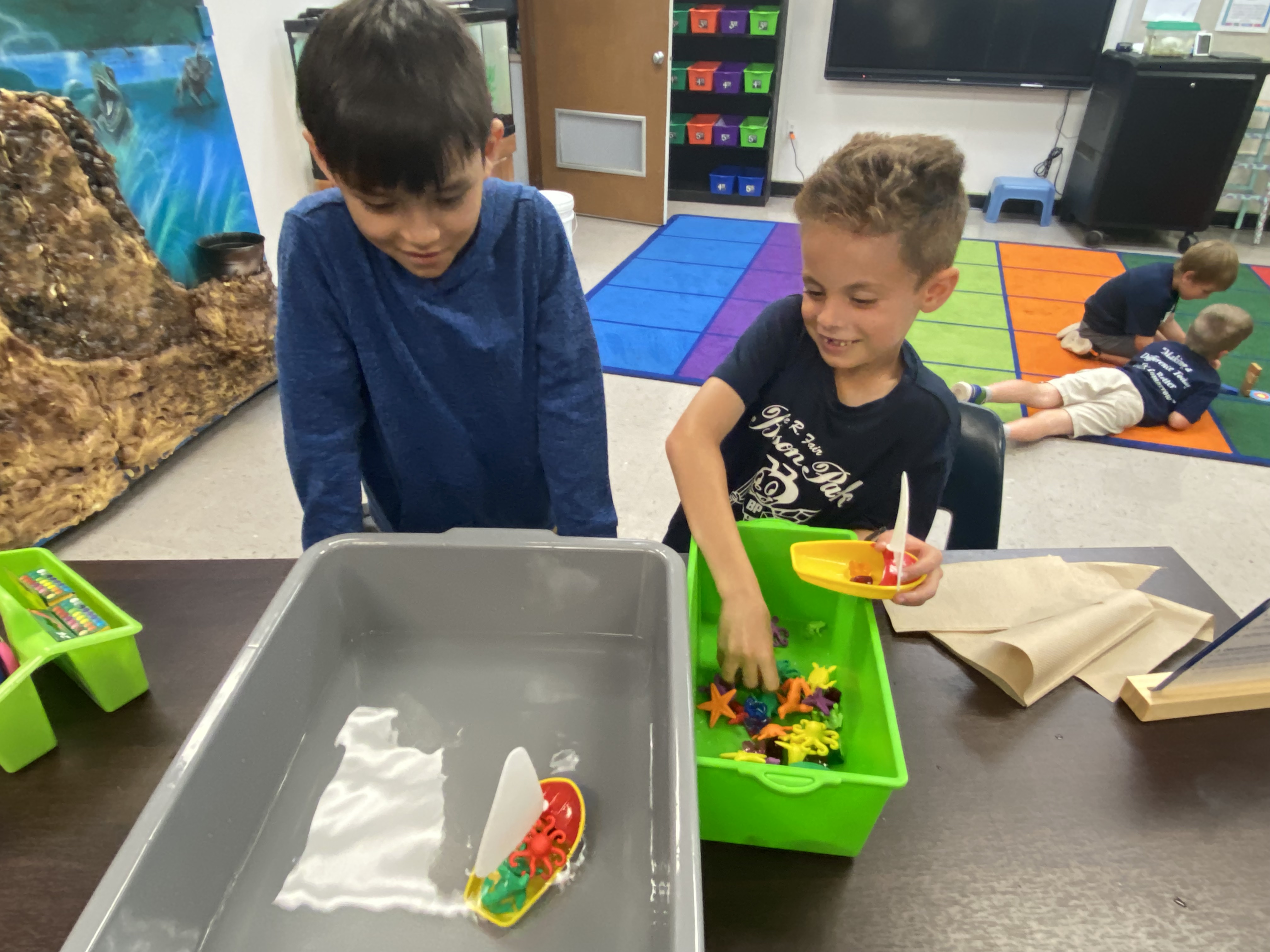 1st Grade students exploring if things sink or float.
