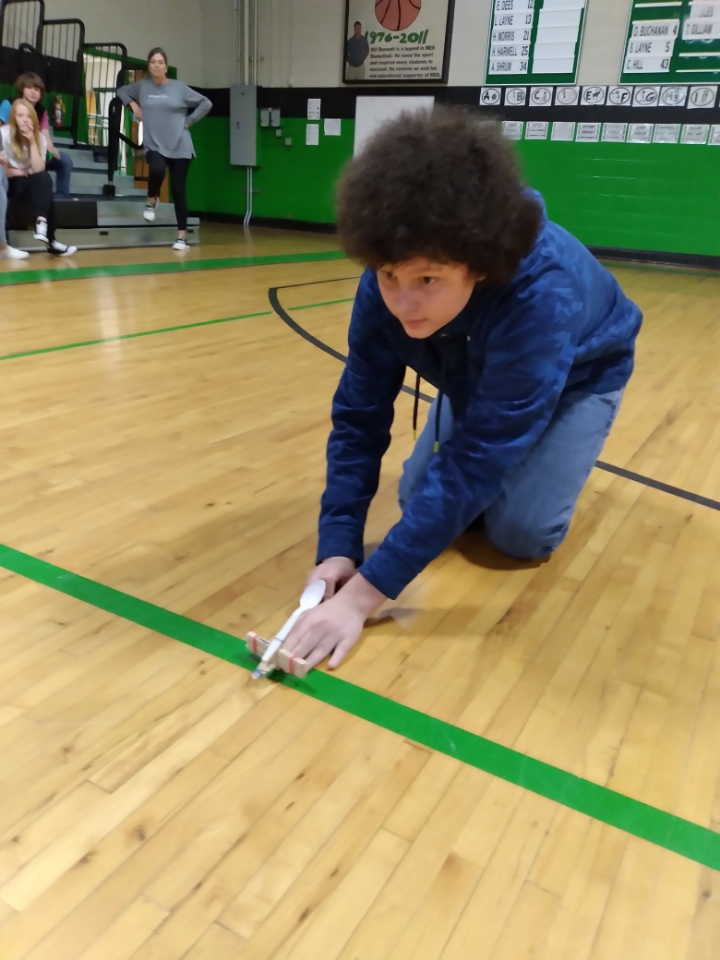 How far Brilyn, the winner, shot her trebuchet/catapult  Mrs. Natalie's 7th grade SS class is learning about Medieval Europe. On top of reading excerpts from The Canterbury Tales, the 7th graders made and demonstrated trebuchet and catapults.
