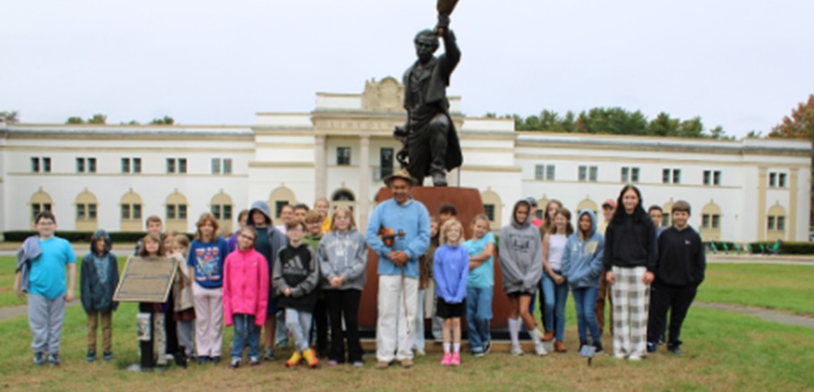 Students in front of statue