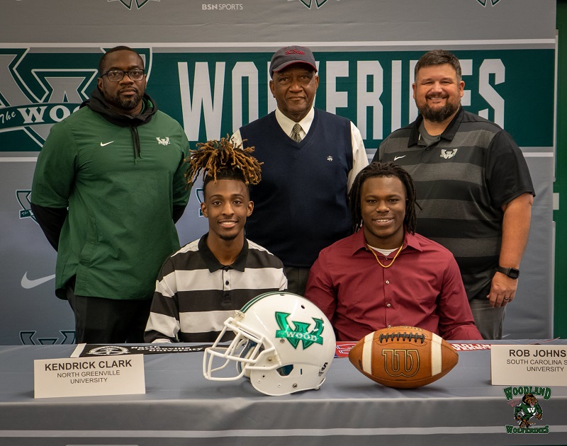 Kendrick Clark and Robert Johnson (Football Signing Day) with Coach Ford, Superintendent Wright, and Assistant Principal Lakin