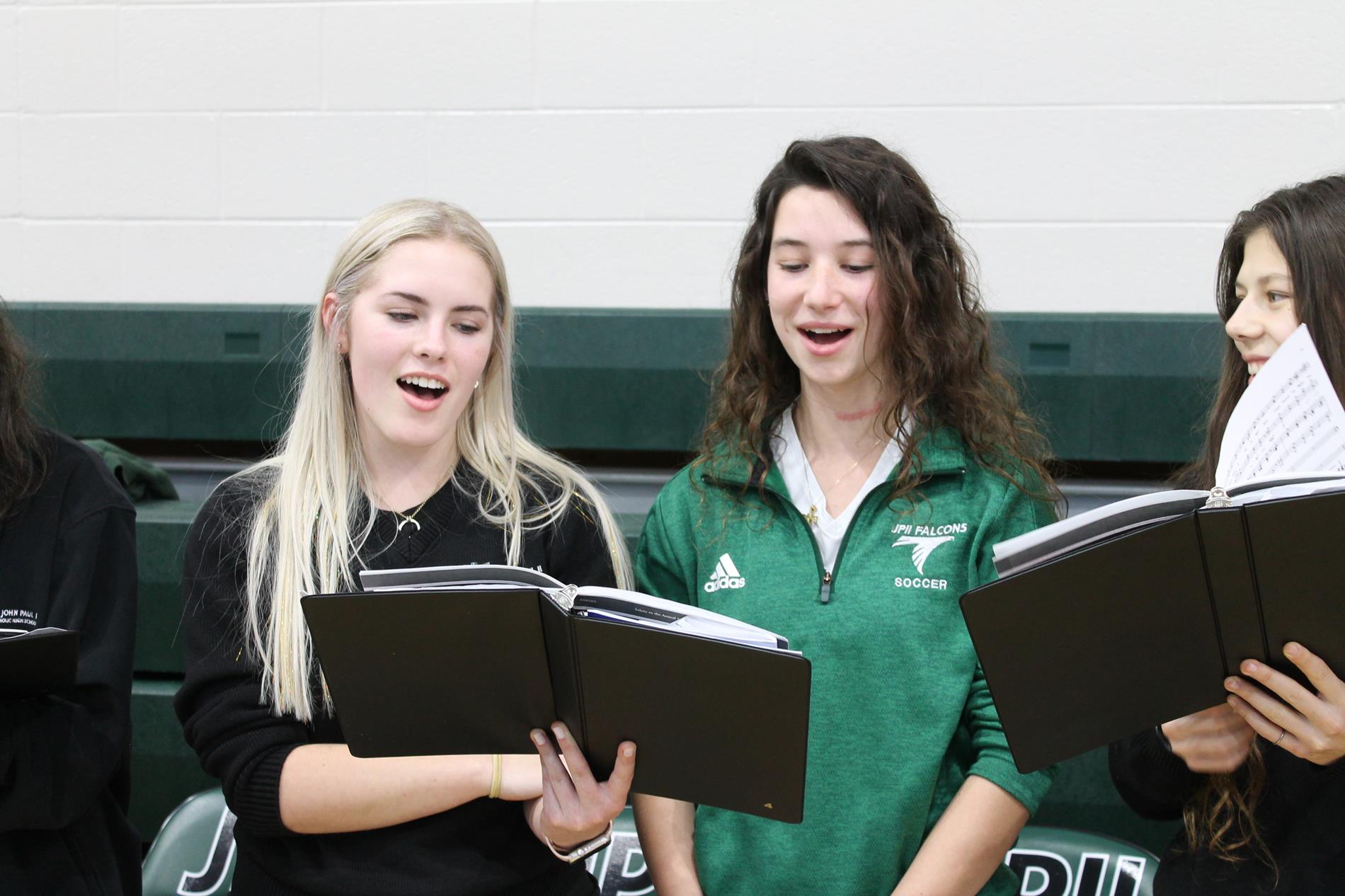 Students singing at an assembly