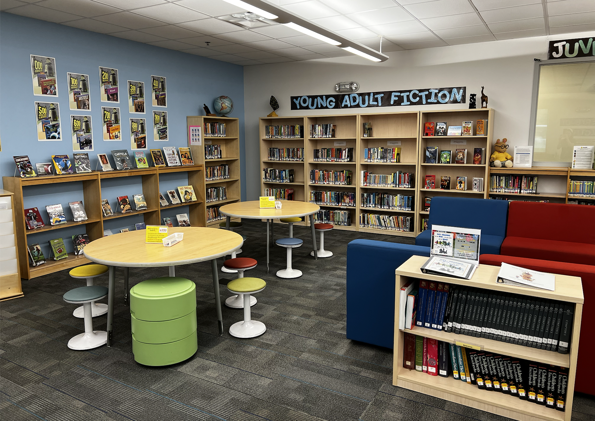 Learning Commons new arrivals section, young adult and juvenile fiction, flexible seating areas