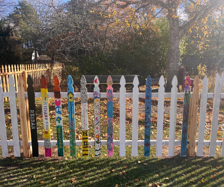 Colorful pickets painted by families adorn the Adams Elementary garden fence