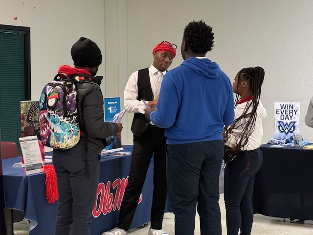 Students talking with the University of Mississippi