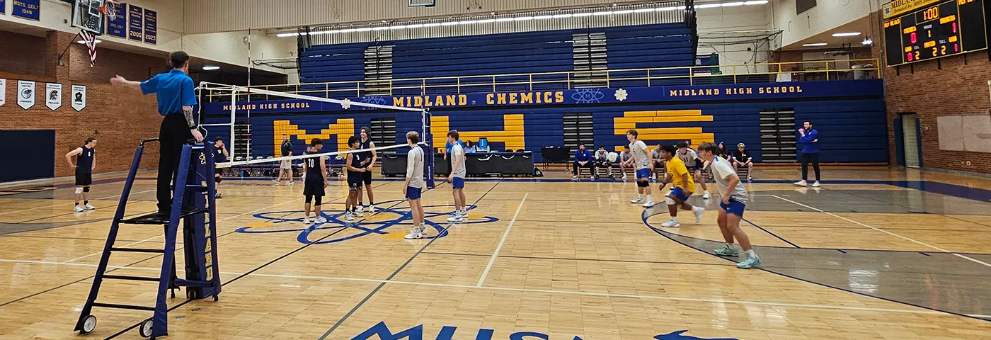Boys playing volleyball. Enroll today for opportunities like this at https://www.midlandps.org/enrollment