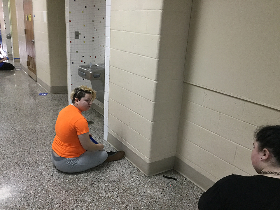 Students volunteering to help paint