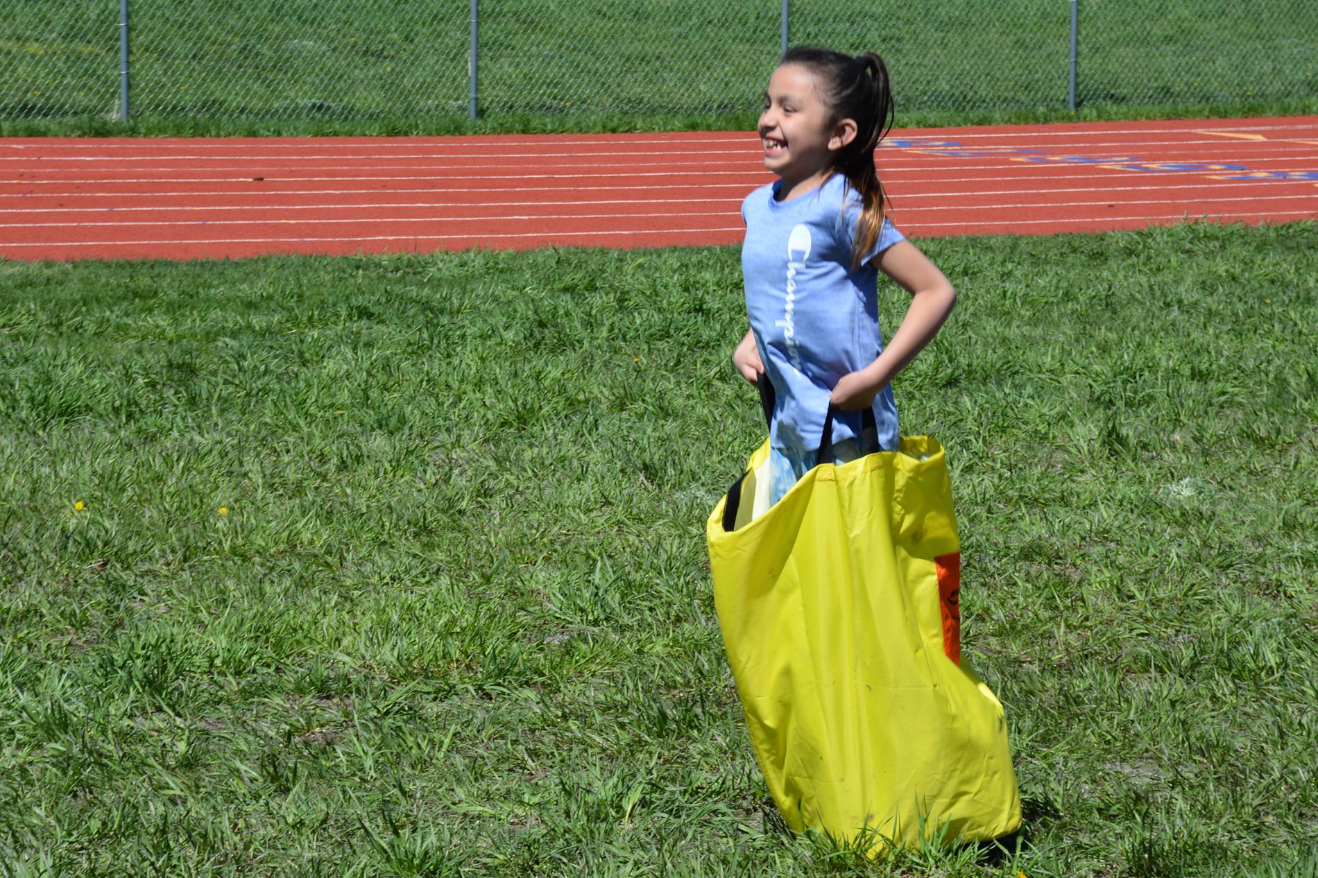 Student in sack race