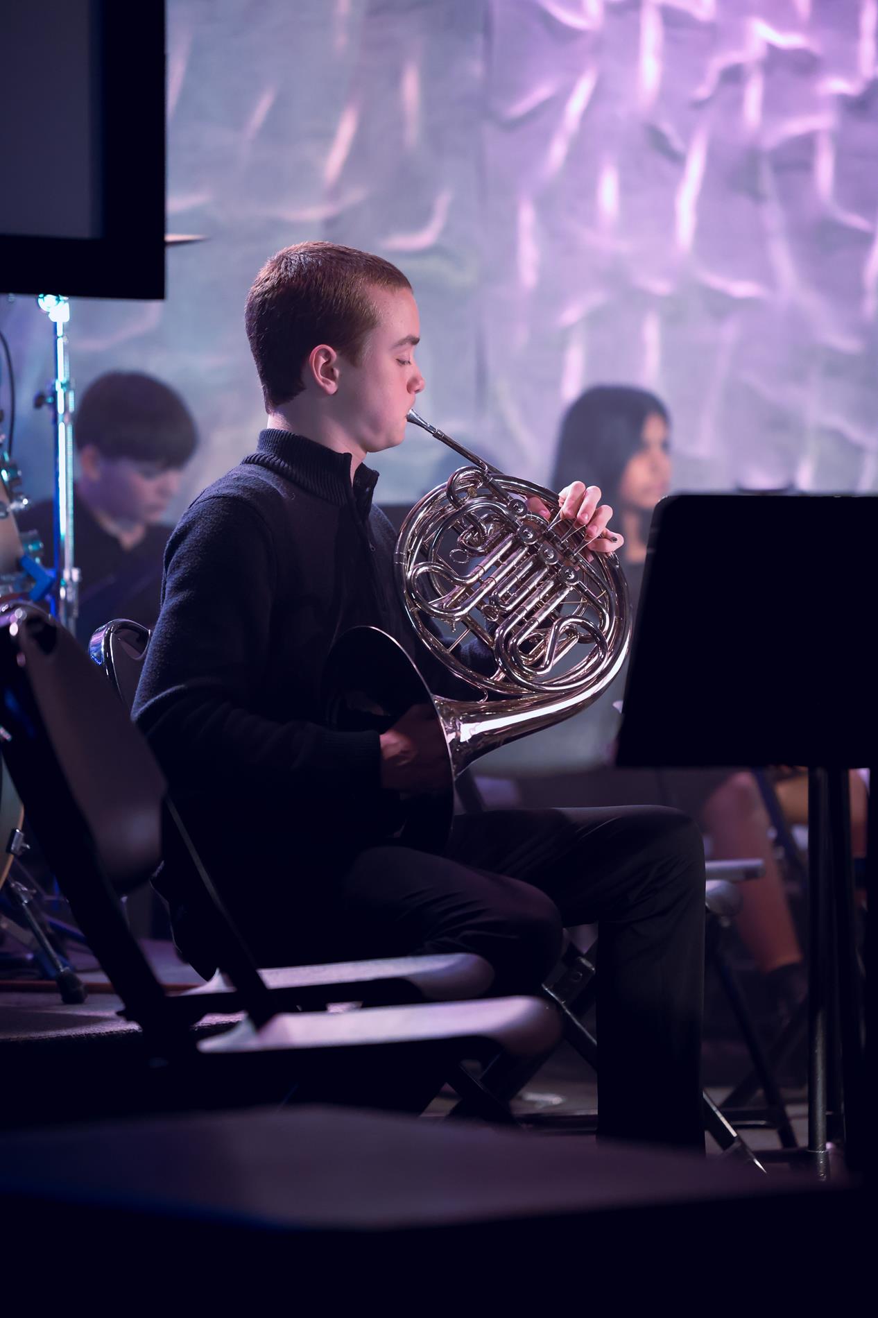 Student Playing the French Horn