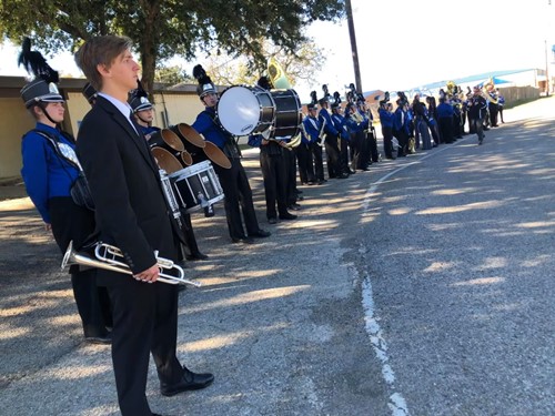 band standing on street