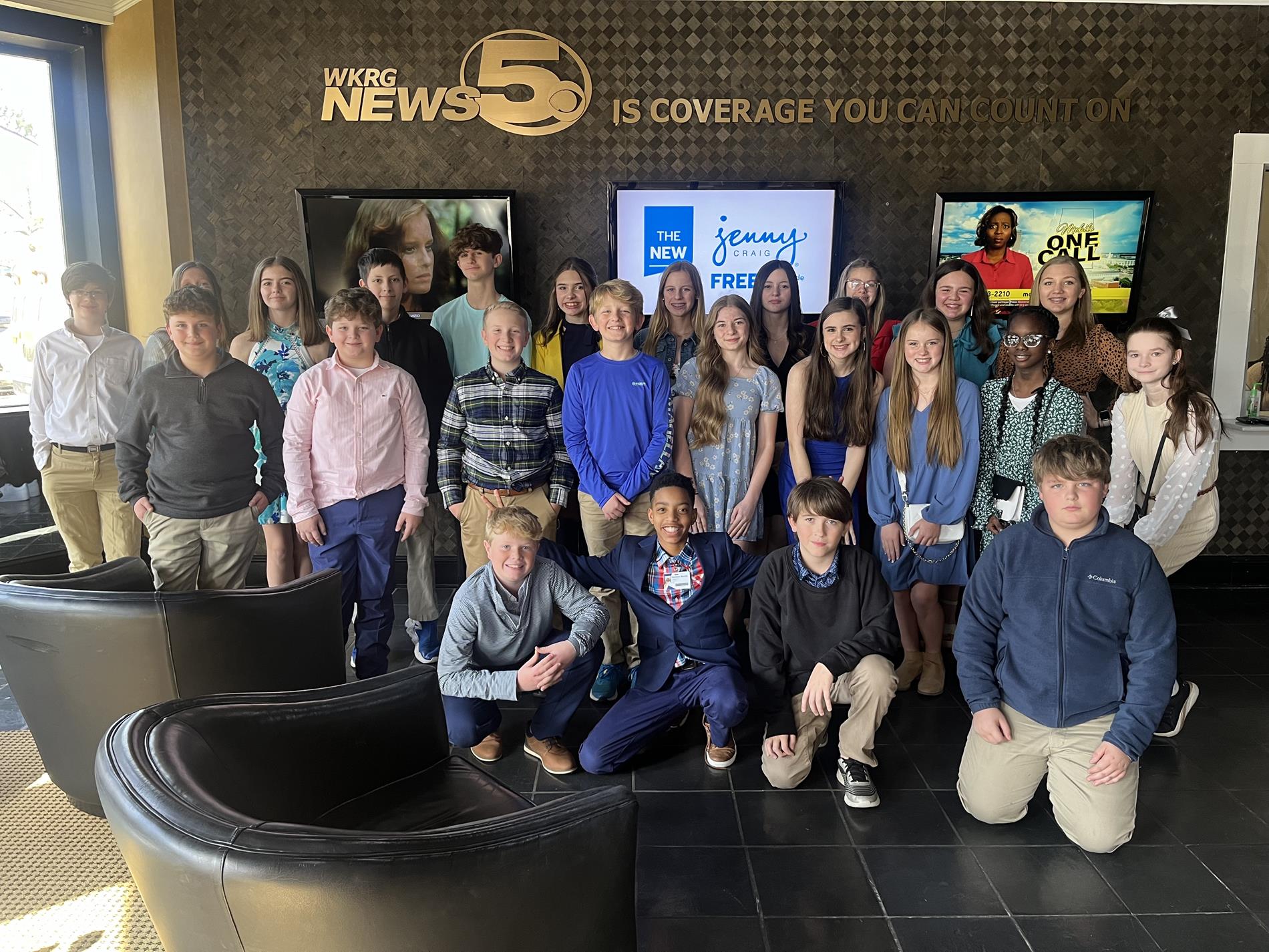 Broadcasting team at news station for a field trip