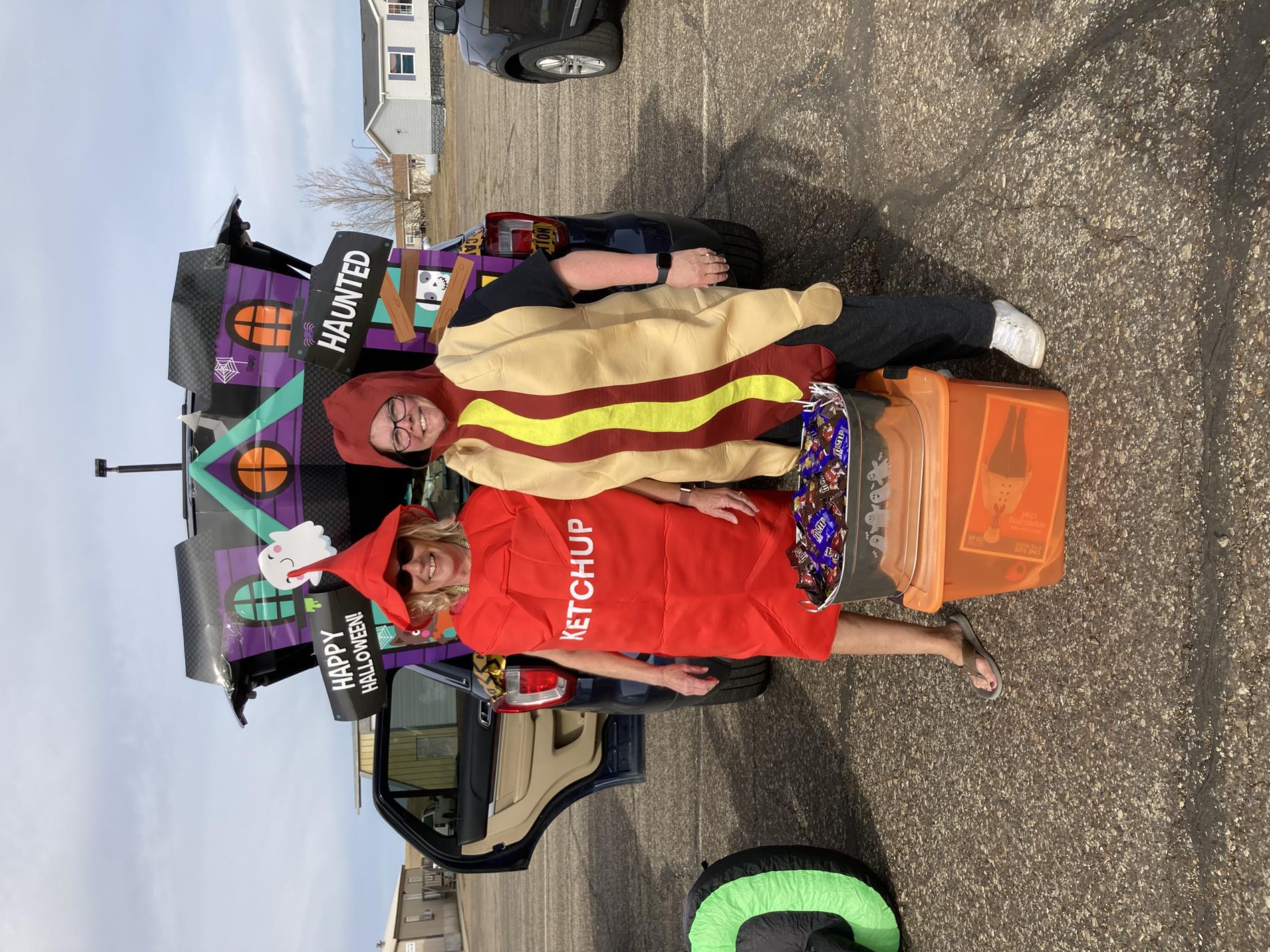Staff dressed up as hot dog and ketchup 