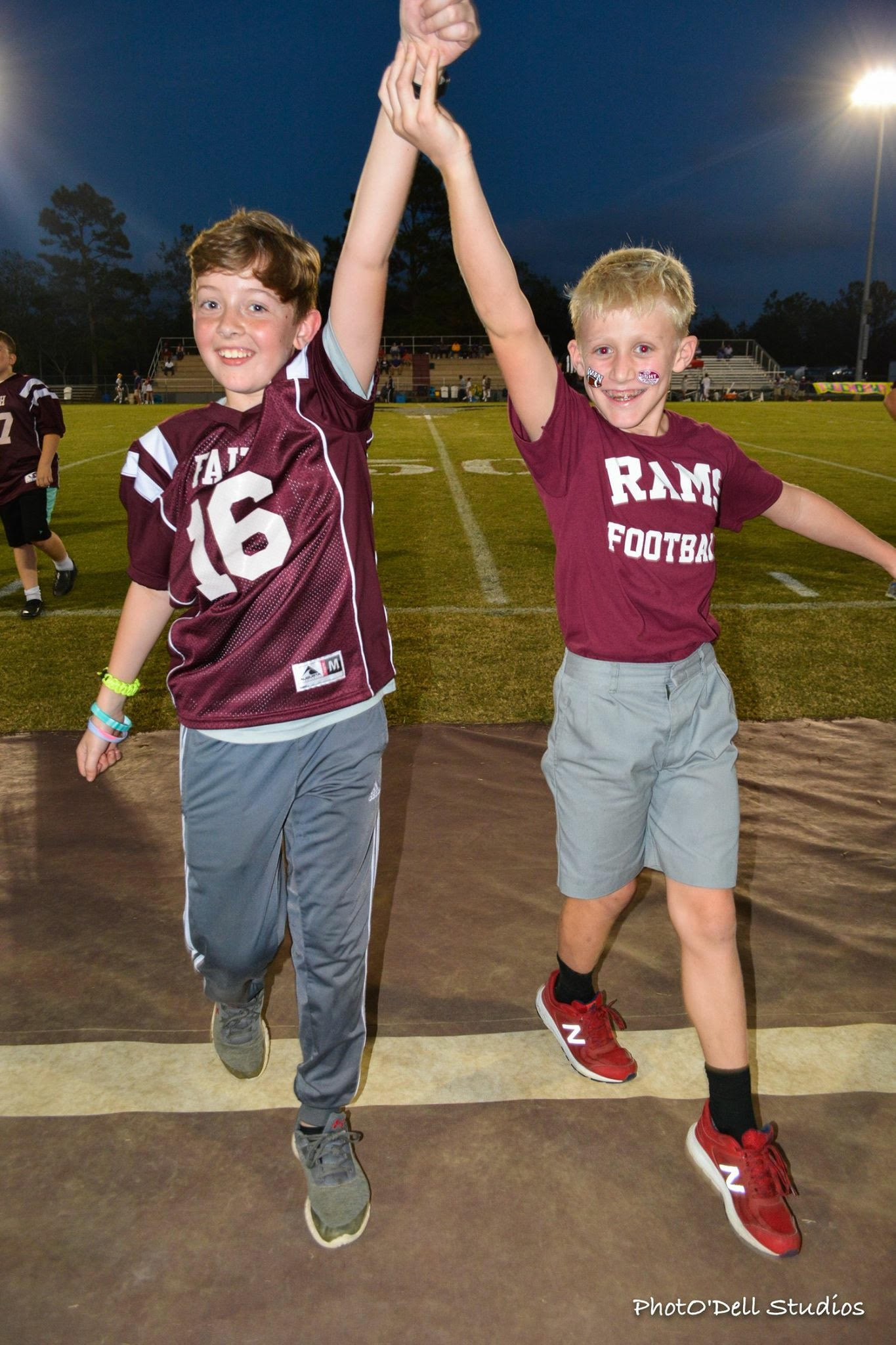 two kids at football game