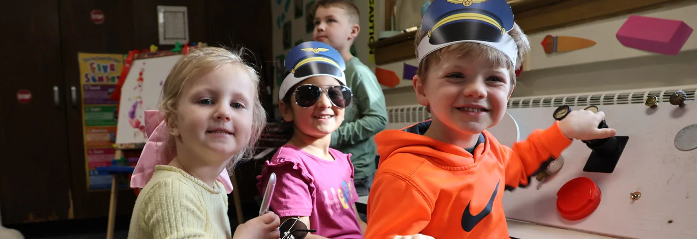 Happy children in their classroom. Enroll today for opportunities like this at https://www.midlandps.org/enrollment