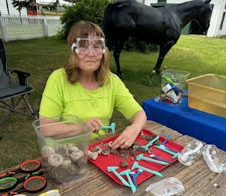 Miss Katie breaks open a treasure stone