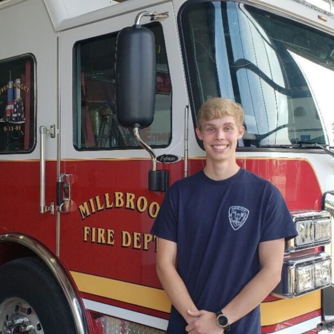 Garrett Buchner Photo in Front of Millbrook Fire Department Truck
