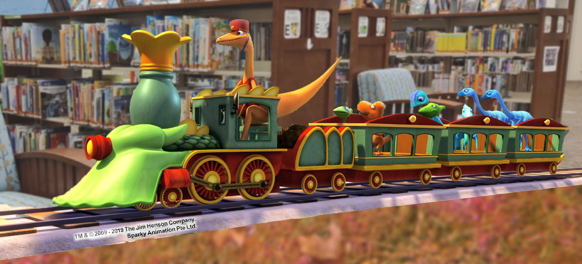Dinosaur Train from the television series riding through the SFPL Juvenile section