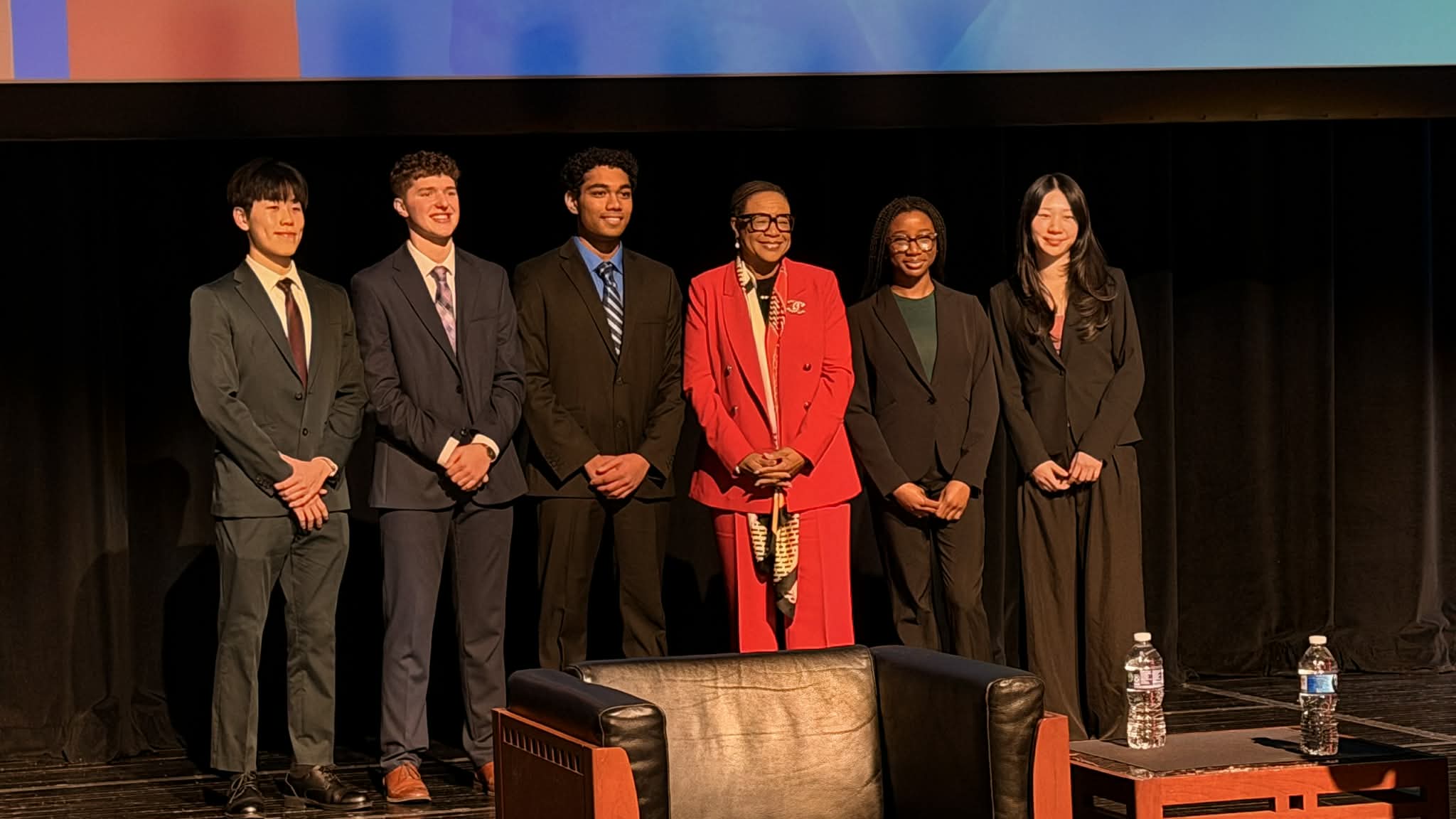Four Dow High students pose with a Bullock Creek student and Cynt Marshall