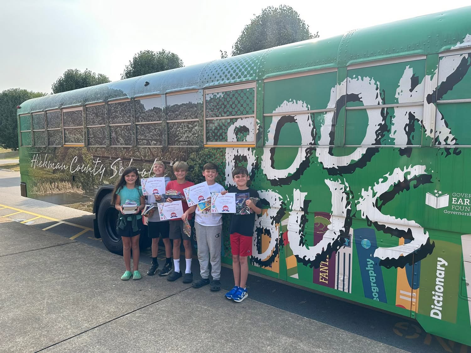 Book Bus with children posing for a picture