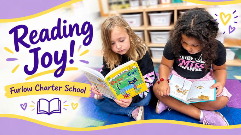 2 Girls reading on the floor