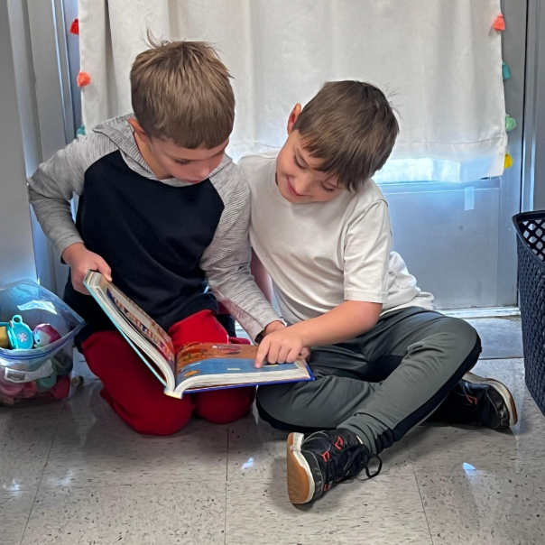 Students reading together in library