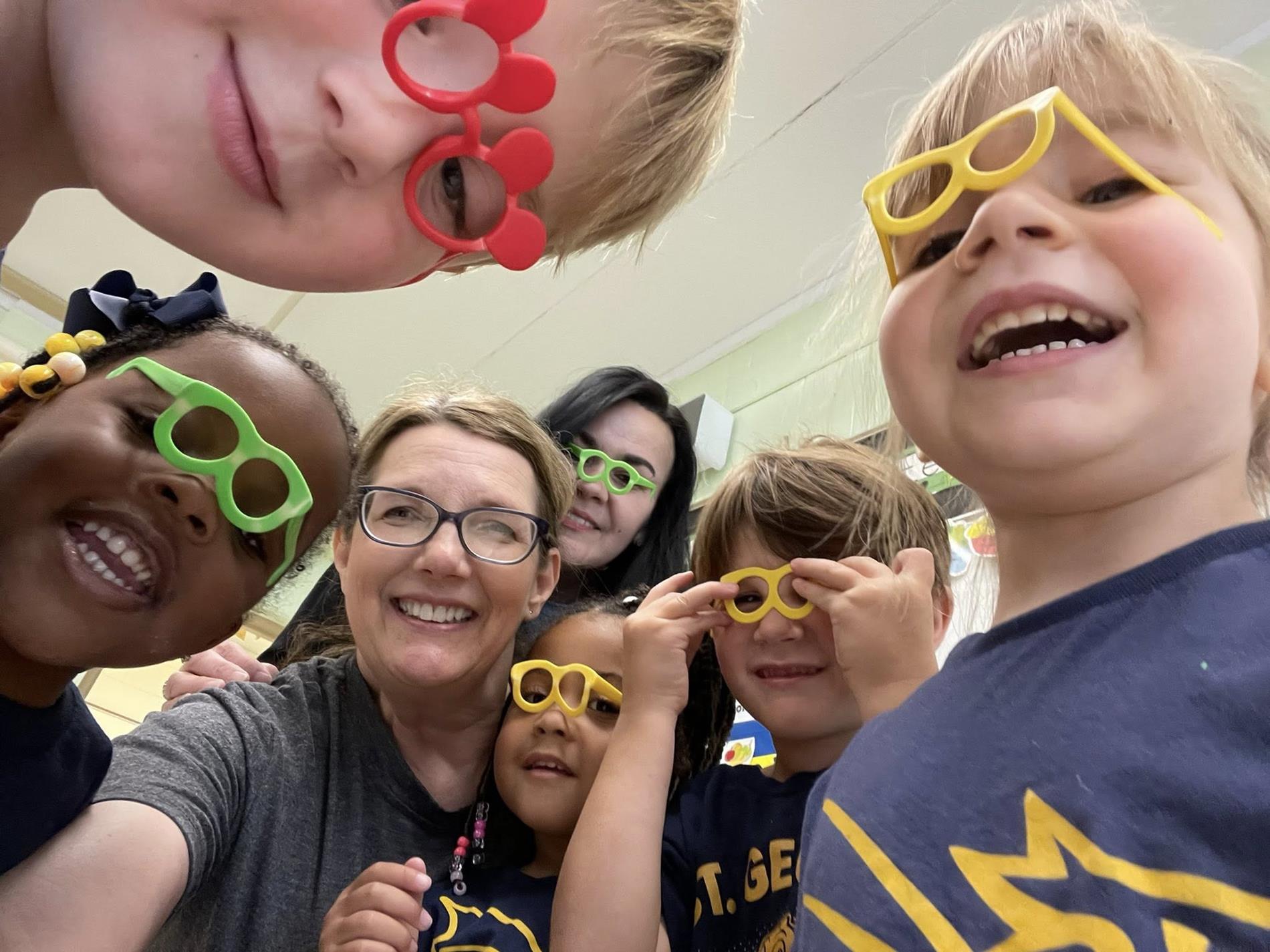 Young children in play glasses