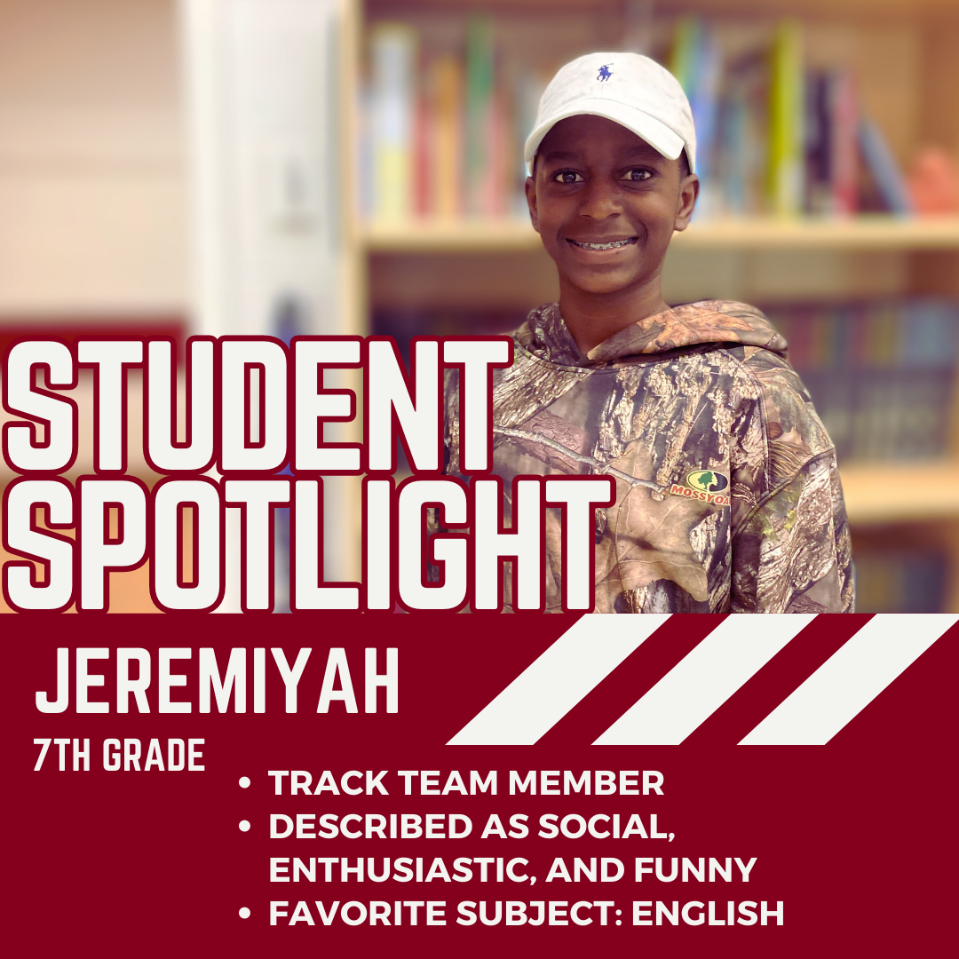 Jeremyah in front of a bookcase. Jeremiyah 7th Grade, track team member, described as funny, enthusiastic, 