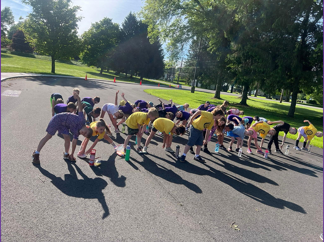 Field Day 2026 Students Stretching for Field Day