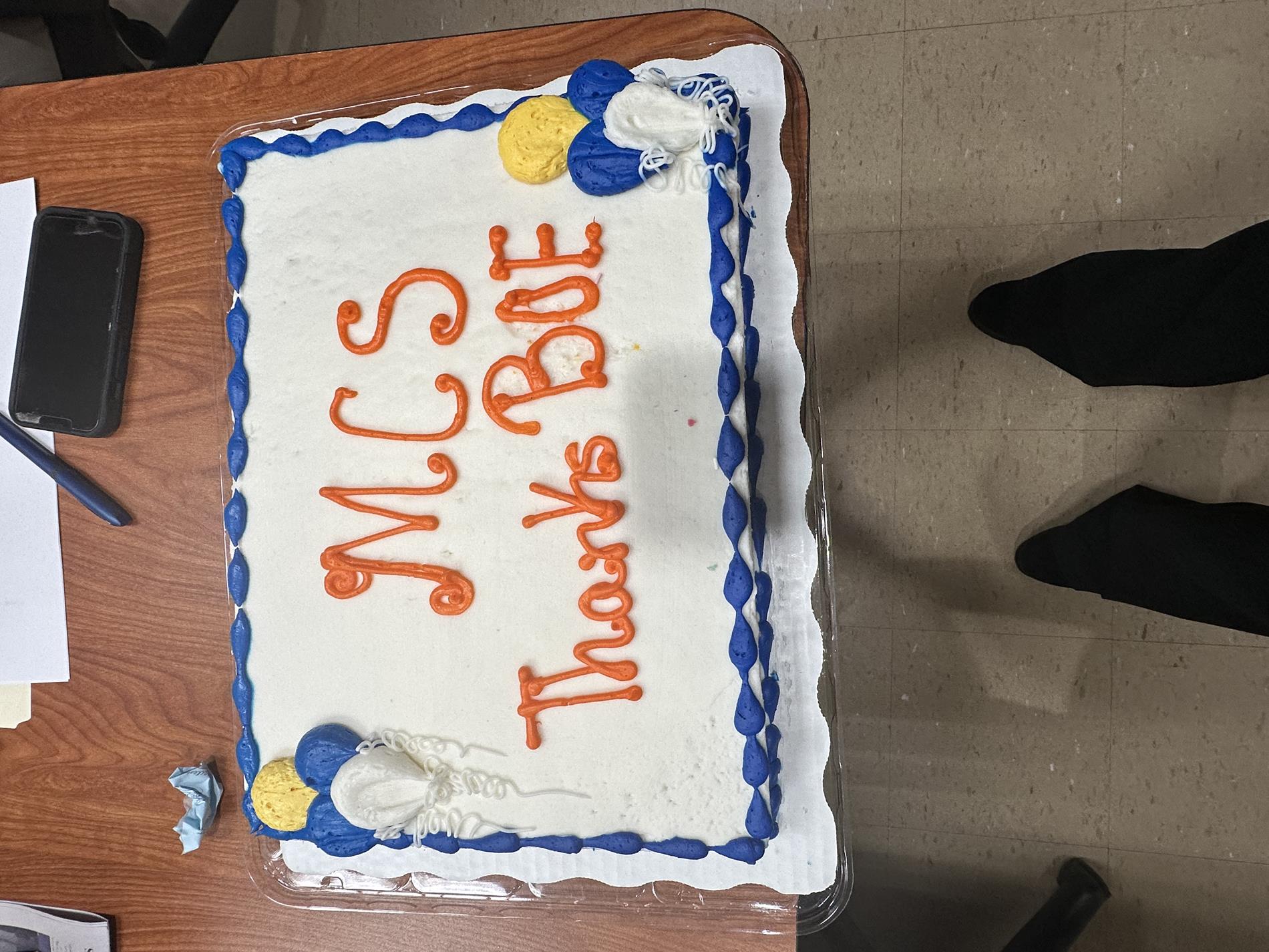 Superintendent Presents School Board with Cake For Board Appreciation week.