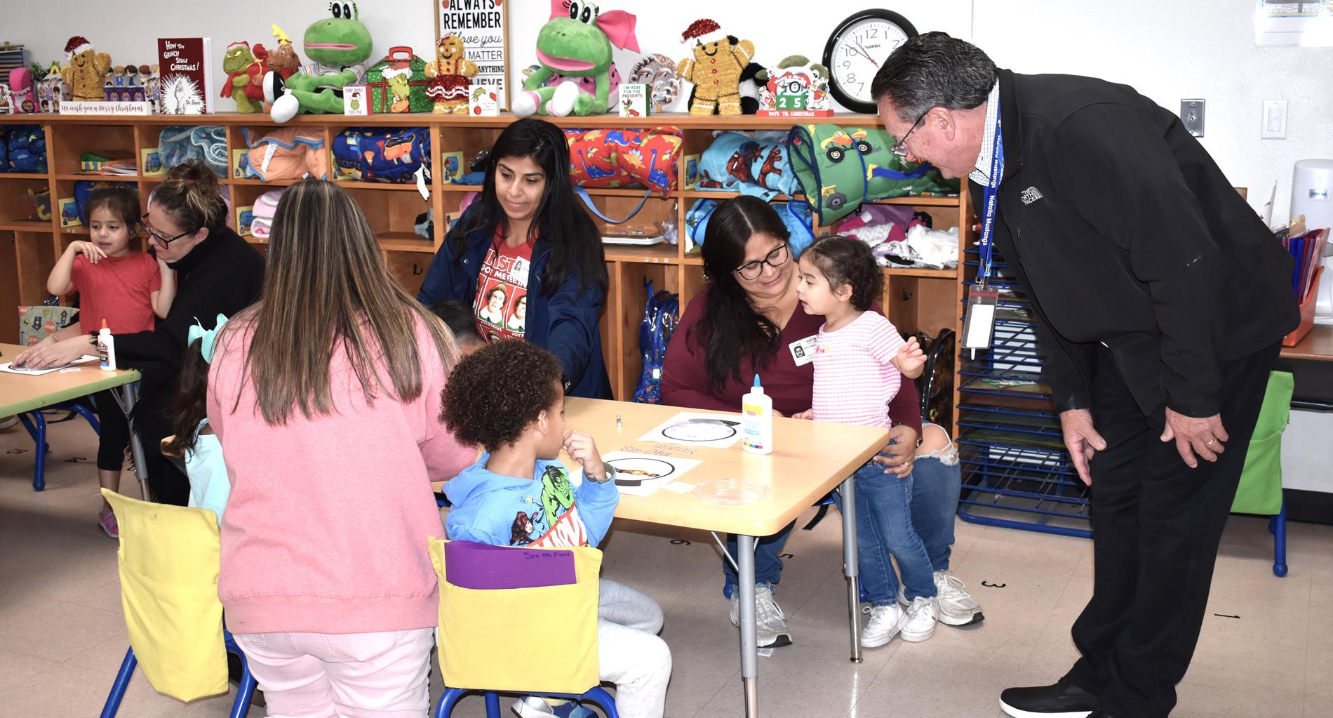 Parents and students working snow globe project