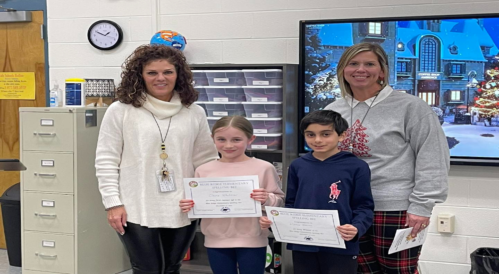 BRES admin duo with the two winners from our school's spelling bee