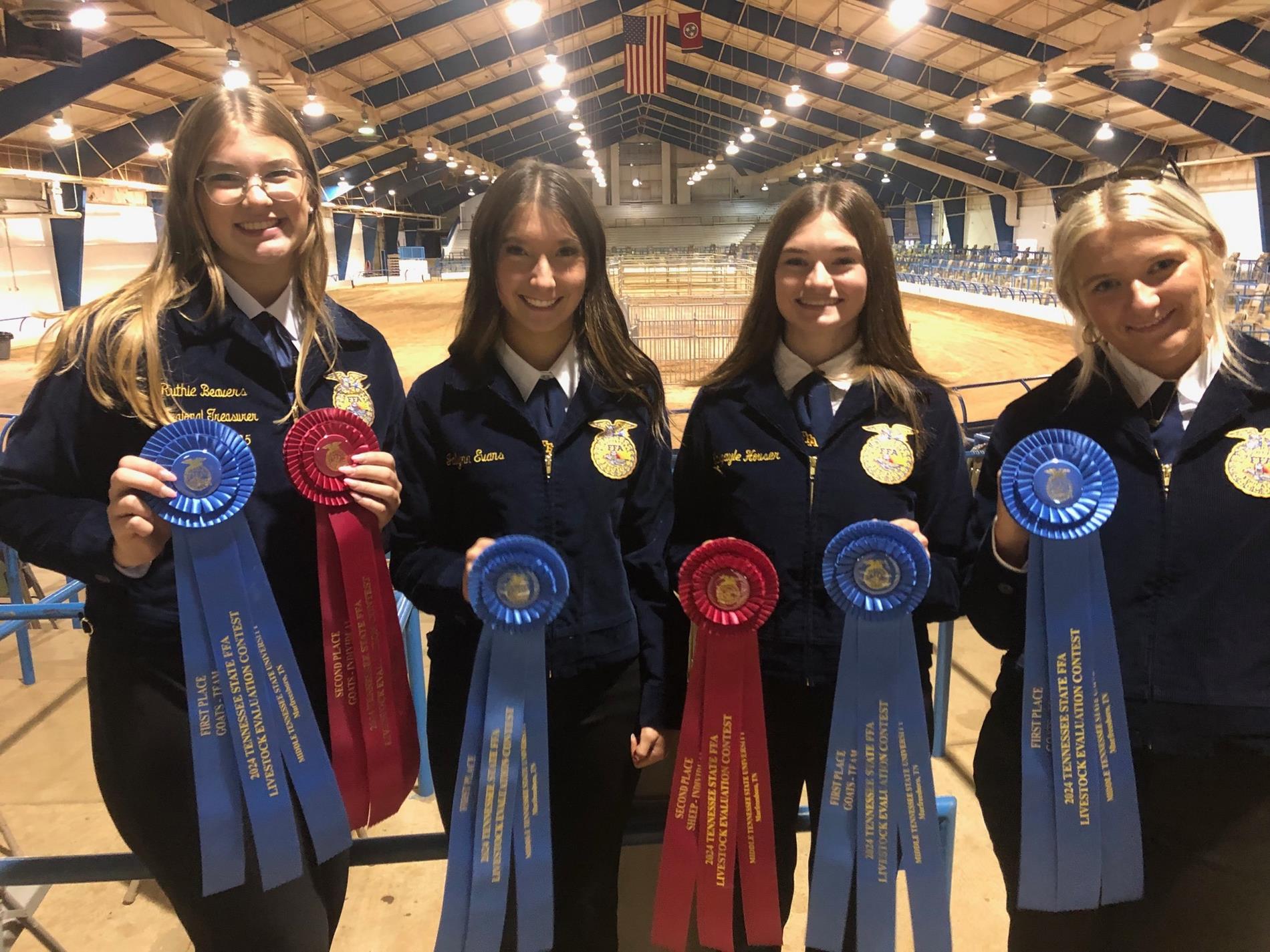 4 girls showing ribbons