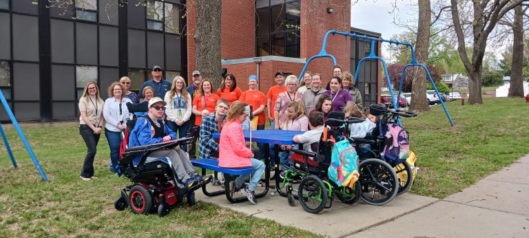 Students and staff of the Nebraska Center for the Education of Children who are Blind or Visually Impaired (NCECBVI) joined the Honeywell Inclusion and Diversity Committee on April 22 to celebrate the delivery of two wheelchair-accessible picnic tables for the center. Photo by Julie Davis