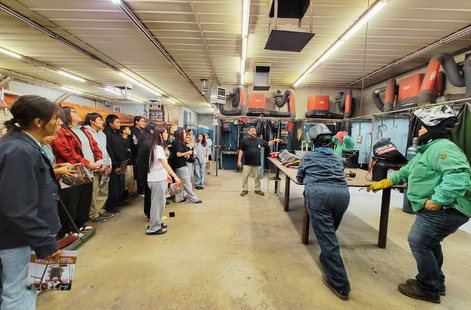 Students gathered in the welding shop at Leupp Schools