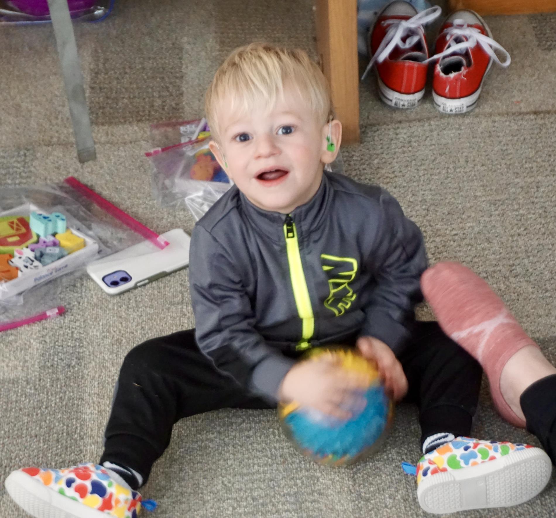 cute toddler boy with hearing aids