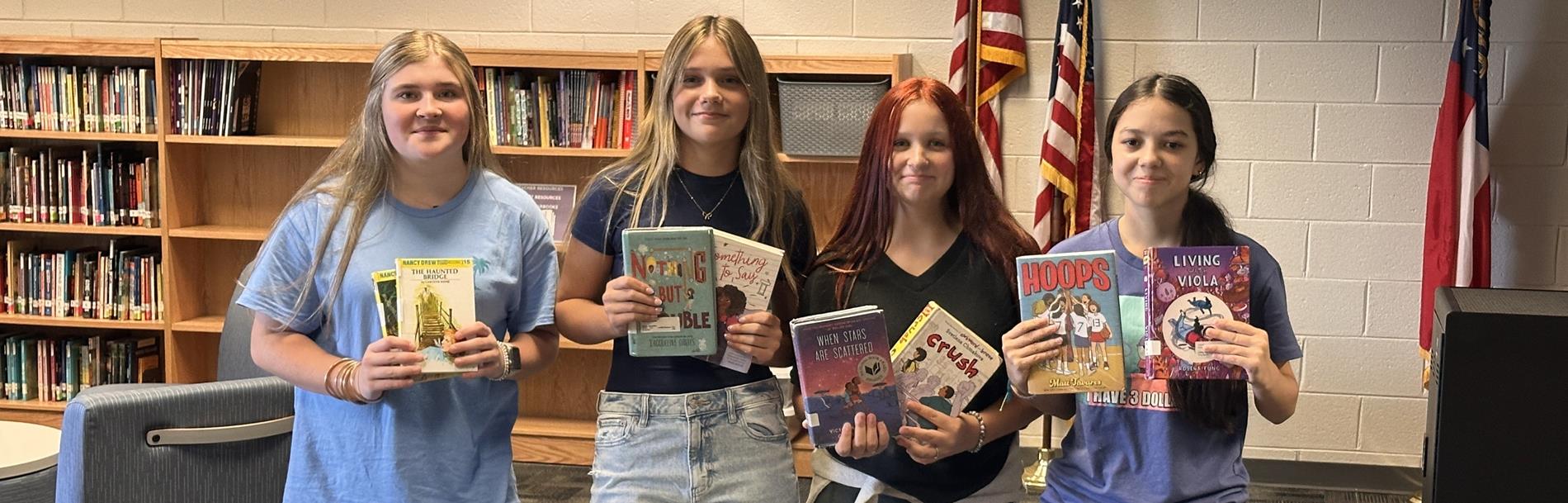Students checking out books
