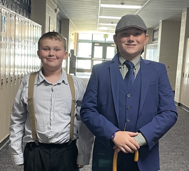 Two boys dressed as passengers on the Titanic.
