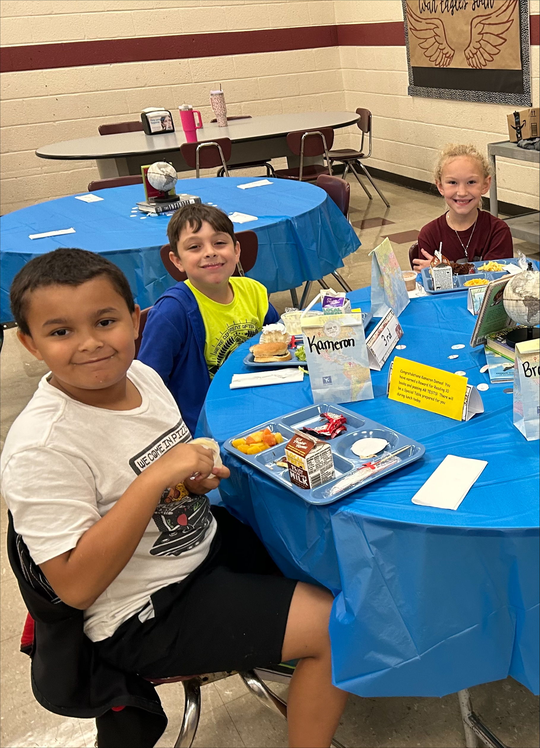  WCES Librarian Mrs. Pat Hudgins issued a reading challenge for the month of August. Students who read ten or more books and successfully passed ten or more Accelerated Reader (AR) tests were awarded with a special lunch celebration. Each honored reader was treated to cupcakes and ice cream and lunch at decorated tables. Cooper Pinson, one of the participants, expressed his excitement, noting, “We earned a first-class lunch!”