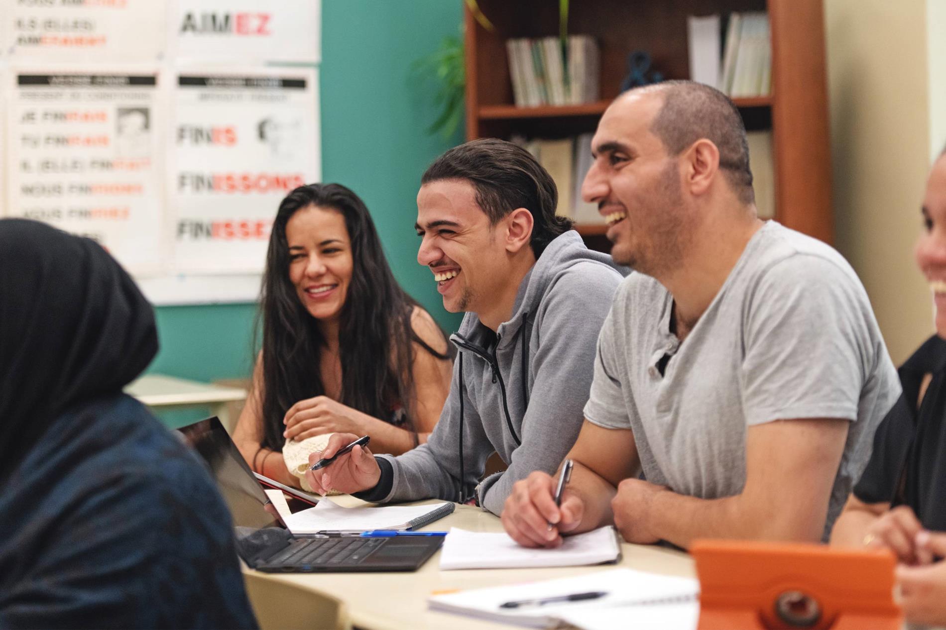 Several adults in a classroom