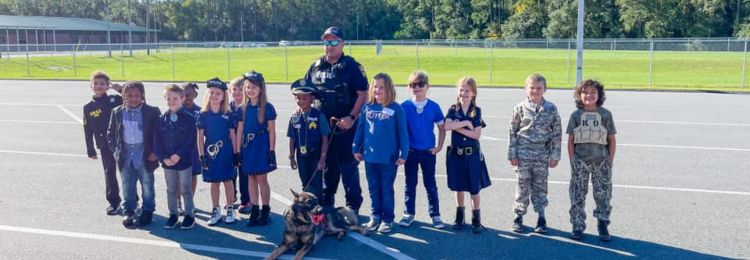 Local officer and his dog with students