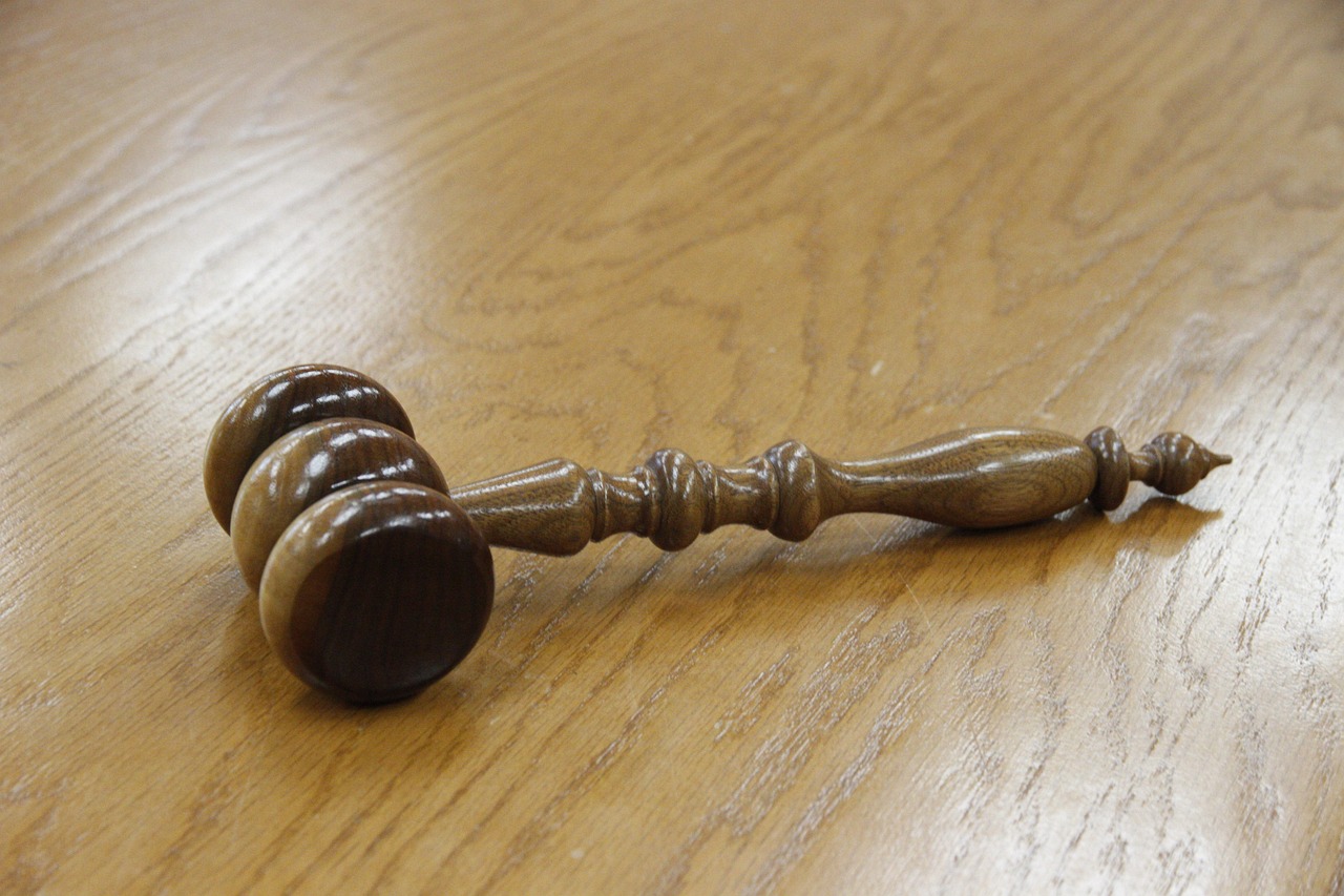A gavel on a wooden table