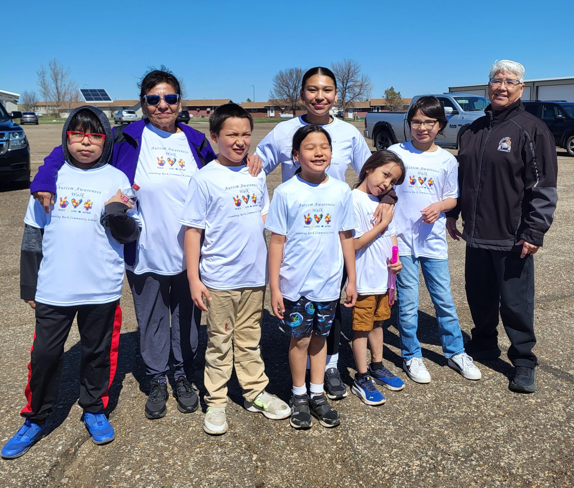 Special Education Director with Miss Standing Rock with a group of walkers