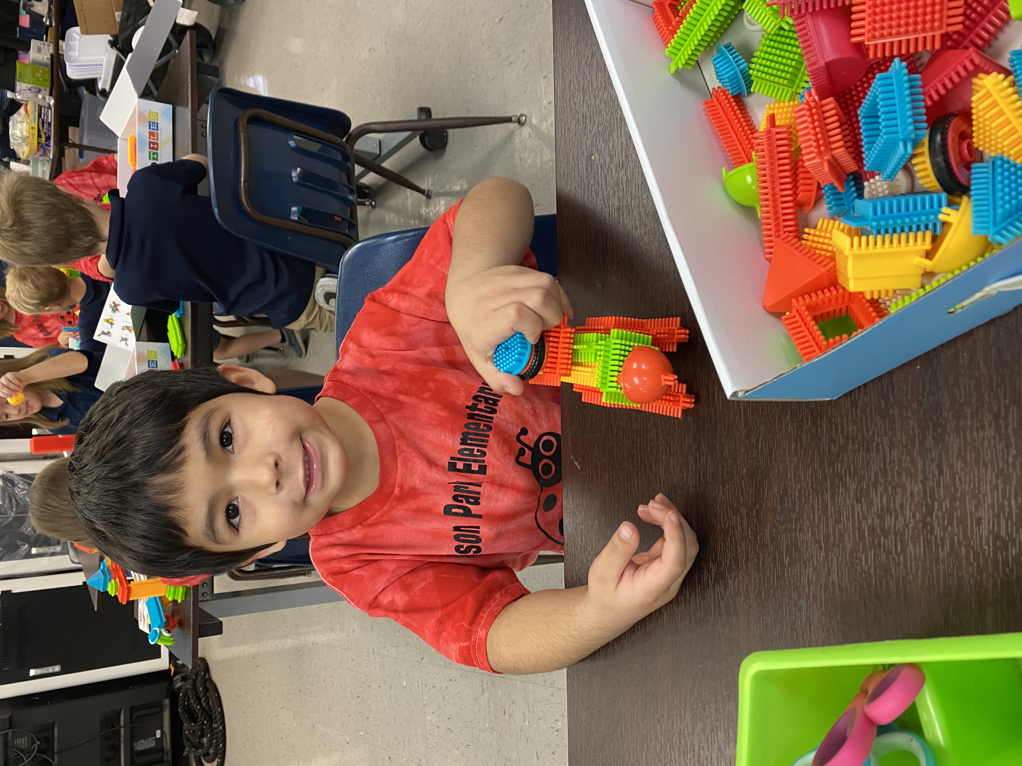 Kindergarten students exploring how to be an engineer with Bristle toys.