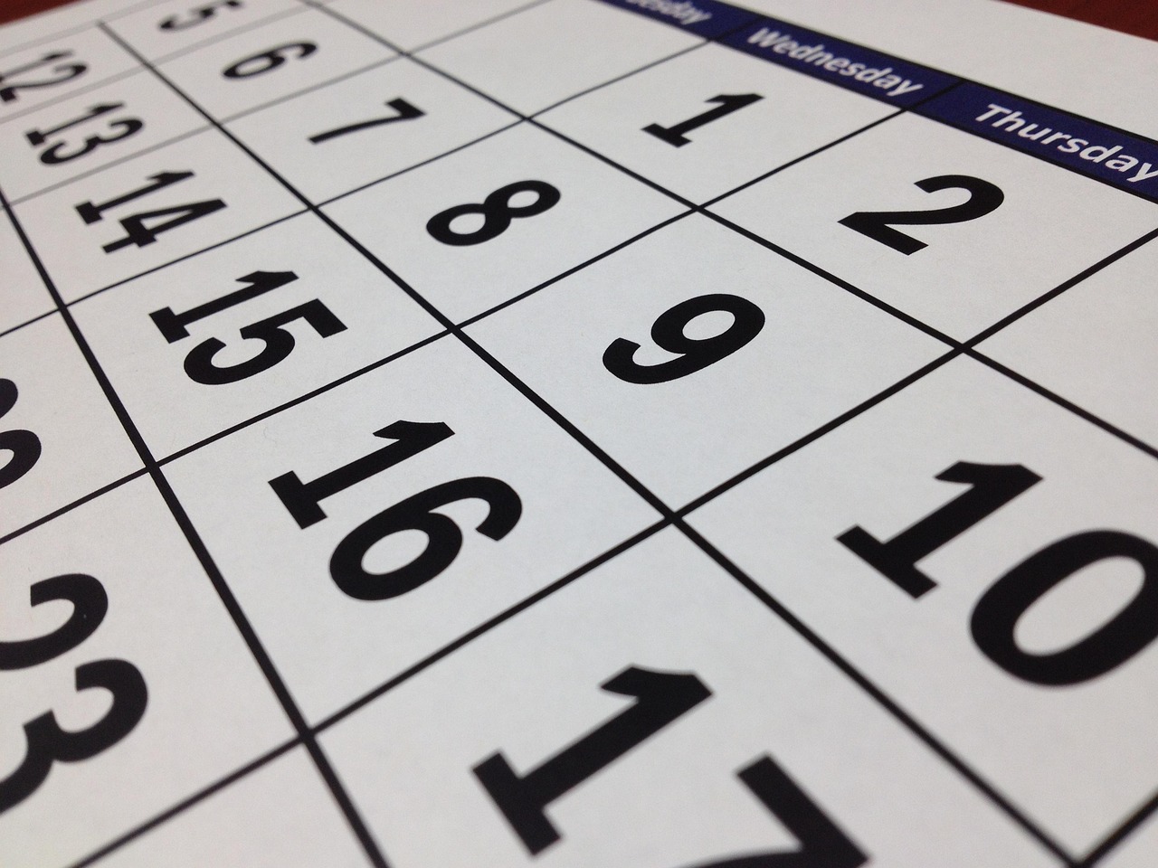 A photo of a calendar grid showing numbered days