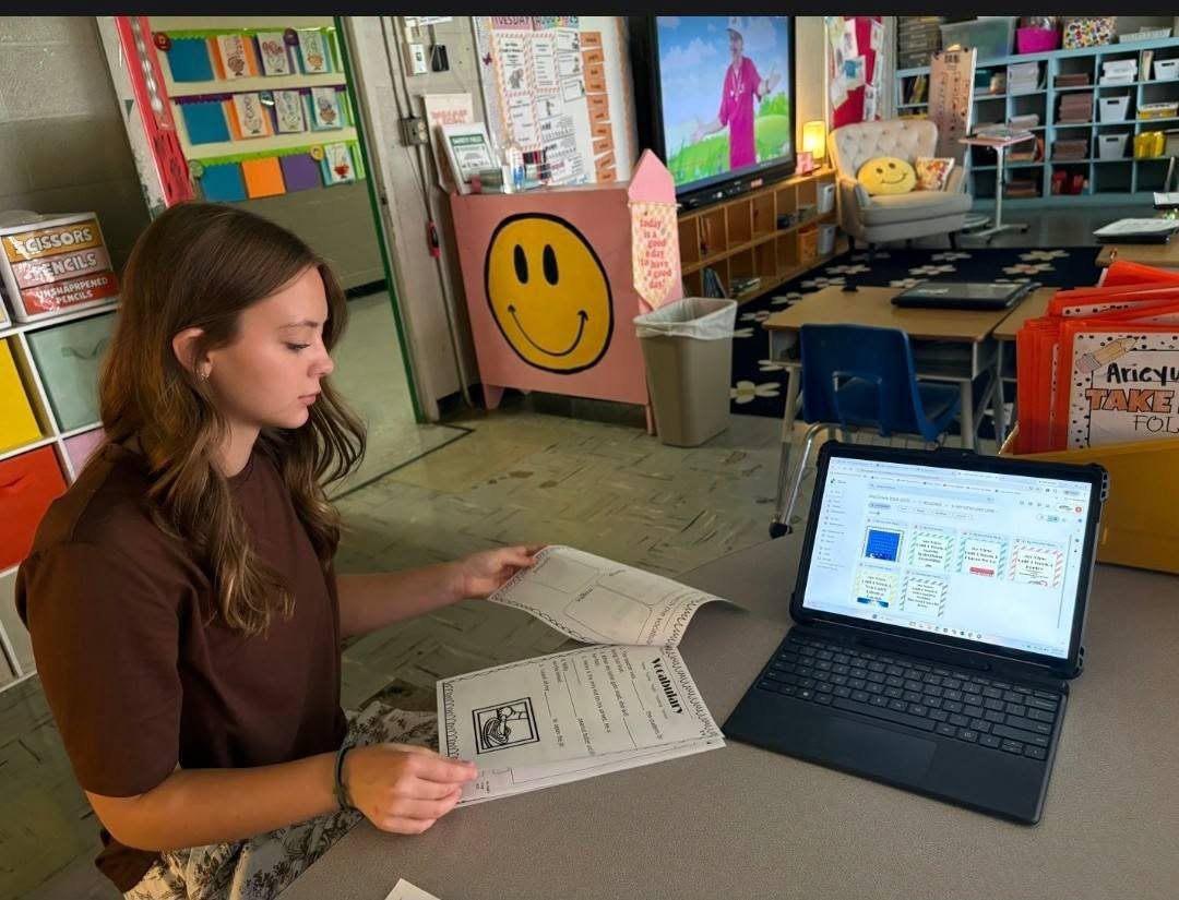 Lillie Andrews reviews instructional materials and digital resources while job shadowing a second-grade teacher at Church Hill Elementary.