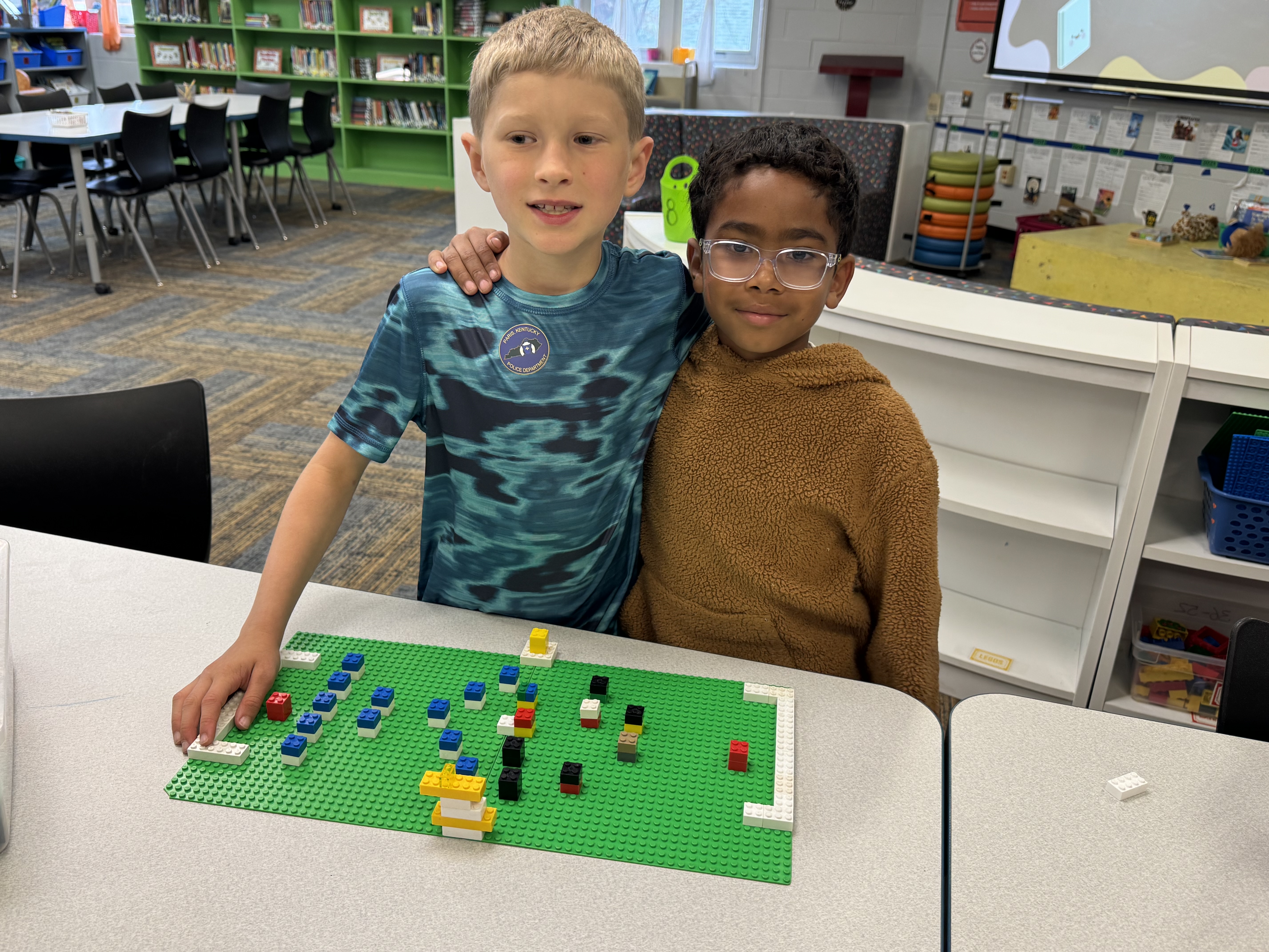 2 students with soccer build