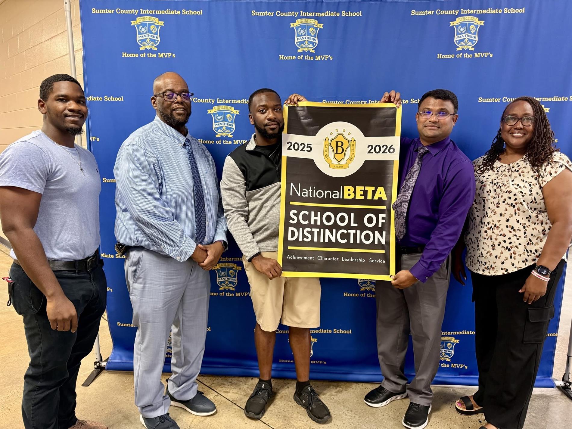 Mr. Floyd presented with National Beta School of Distinction Banner