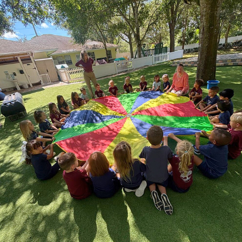 early childhood students playing outside