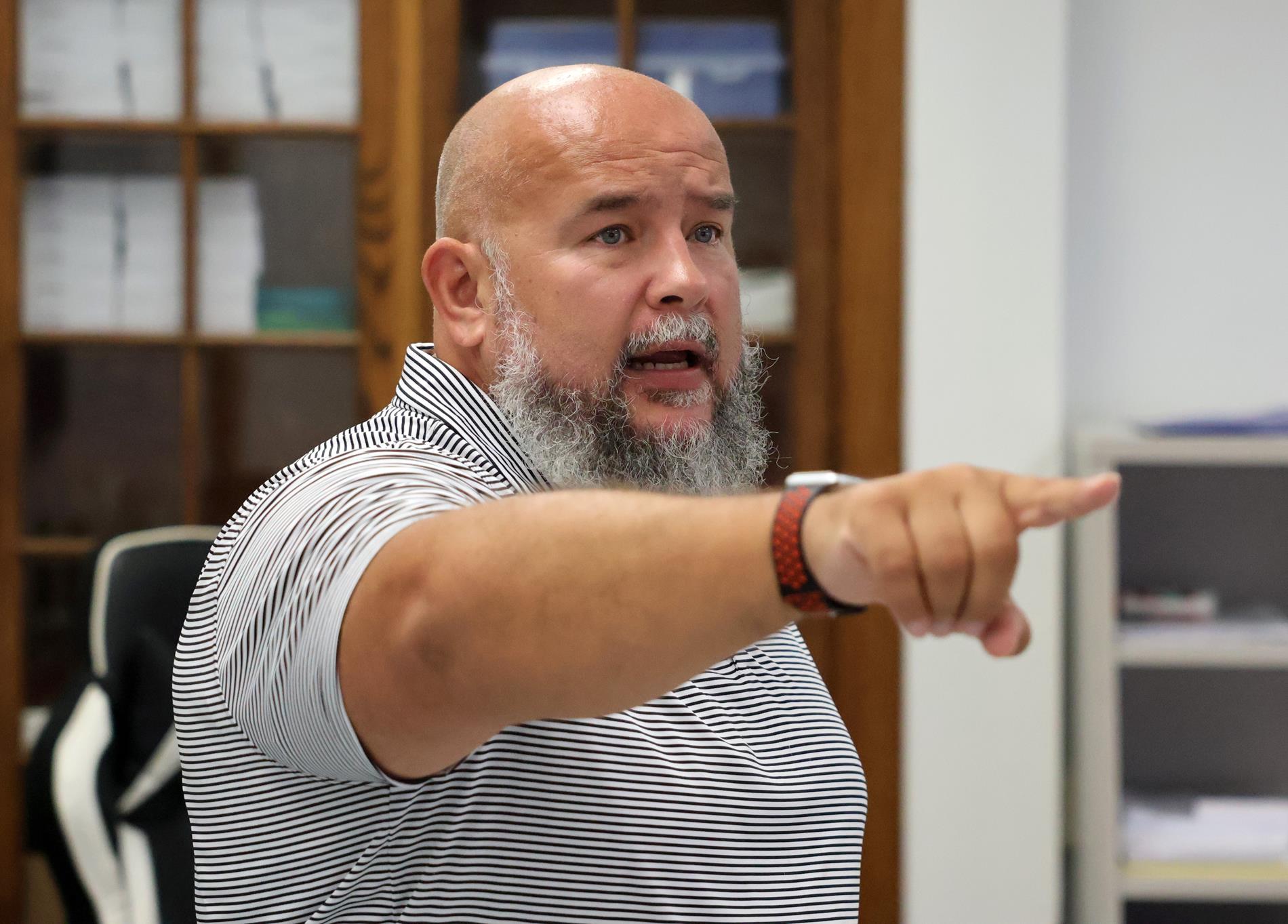 Teacher pointing and speaking