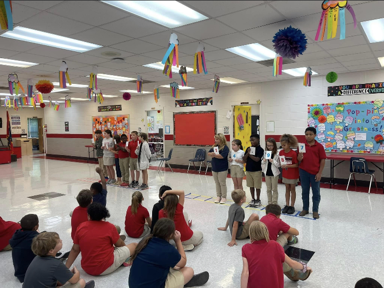 4th grade students acted out place value on Thursday. 